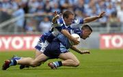 17 July 2005; Senan Connell, Dublin, is tackled by Chris Conway, Laois. Bank of Ireland Leinster Senior Football Championship Final, Dublin v Laois, Croke Park, Dublin. Picture credit; Brian Lawless / SPORTSFILE
