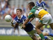 17 July 2005; Kevin Smith, Laois, is tackled by Ken Casey, Offaly. Leinster Minor Football Championship Final, Offaly v Laois, Croke Park, Dublin. Picture credit; Brian Lawless / SPORTSFILE