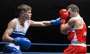 22 February 2014; Michael Nevin, left, Portlaoise Boxing Club, exchanges punches with Sean Duffy, Holy Trinity Boxing Club, during their 60kg bout. National Senior Boxing Championships, First Round, National Stadium, Dublin. Picture credit: Barry Cregg / SPORTSFILE