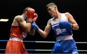 22 February 2014; Michael Nevin, right, Portlaoise Boxing Club, exchanges punches with Sean Duffy, Holy Trinity Boxing Club, during their 60kg bout. National Senior Boxing Championships, First Round, National Stadium, Dublin. Picture credit: Barry Cregg / SPORTSFILE