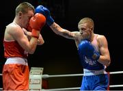 22 February 2014; Dean Walsh, right, St.Joseph's/Ibars Boxing Club, exchanges punches with Ciaran Bates, St. Mary's Boxing Club, during their 64kg bout. National Senior Boxing Championships, First Round, National Stadium, Dublin. Picture credit: Barry Cregg / SPORTSFILE