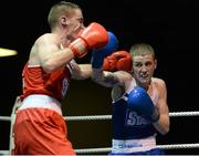 22 February 2014; Dean Walsh, right, St.Joseph's/Ibars Boxing Club, exchanges punches with Ciaran Bates, St. Mary's Boxing Club, during their 64kg bout. National Senior Boxing Championships, First Round, National Stadium, Dublin. Picture credit: Barry Cregg / SPORTSFILE