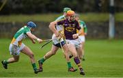 23 February 2014; Andrew Shore, Wexford, in action against Chris McDonald and Joe Bergin, Offaly. Allianz Hurling League Division 1B Round 2, Wexford v Offaly, O'Kennedy Park, New Ross, Co. Wexford. Picture credit: Matt Browne / SPORTSFILE