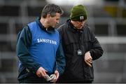 23 February 2014; Limerick joint managers TJ Ryan, left, and Donal O'Grady look at the time as the national anthem begins during their pre-match warm-up. Allianz Hurling League Division 1B Round 2, Limerick v Antrim, Gaelic Grounds, Limerick. Picture credit: Diarmuid Greene / SPORTSFILE