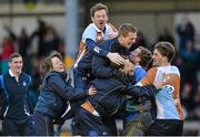 23 February 2014; The Three Rock Rovers team celebrate with Peter mcConnell, hidden, after he scored his side's winning goal in a penalty stroke shoot out after extra time. Irish Men's Senior Cup Final, Pembroke Wanderers v Three Rock Rovers, National Hockey Stadium, UCD, Belfield, Dublin. Picture credit: Brendan Moran / SPORTSFILE