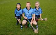 23 February 2014; Mascots Éile O Ceallaigh, age 11, left, and Aishling Cullen, age 10, from Whitehall, Dublin, with Dublin captain, John McCaffrey before the game. Allianz Hurling League Division 1A Round 2, Dublin v Clare, Parnell Park, Dublin. Picture credit: Stephen McCarthy / SPORTSFILE