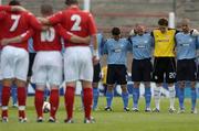 13 July 2005; Shelbourne players, right, stand opposite Glentoran players during a minute silence before the start of the game. UEFA Champions League Qualifier, Glentoran v Shelbourne, The Oval, Belfast. Picture credit; David Maher / SPORTSFILE