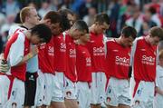 8 July 2005; St. Patrick's Athletic players stand for a minutes silence before the start of the game. eircom League, Premier Division, St. Patrick's Athletic v Shelbourne, Richmond Park, Dublin. Picture credit; David Maher / SPORTSFILE