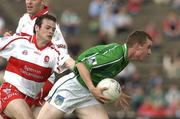 17 July 2005; Seanie Buckley, Limerick, in action against Paul McFlynn, Derry. Bank of Ireland All-Ireland Senior Football Championship Qualifier, Round 3, Derry v Limerick, McHale Park, Castlebar, Co. Mayo. Picture credit; Pat Murphy / SPORTSFILE