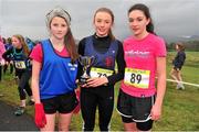 25 February 2014; Laoise Geraghty, Taylor's Hill, Galway, holds up her trophy with runner up, Ciara Holmes, left, St. Joseph's Foxford, Co. Mayo, and third placed finisher Aoife Morris, Ballysadare, Co. Sligo, after winning the minor Girls 2000m race during the Aviva Connacht Schools Cross Country Championships. Sligo Race Course, Sligo. Picture credit: Barry Cregg / SPORTSFILE