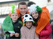 25 February 2014; Team Ireland's Conor Lyne pictured with cousins Eoghan Lyne, aged 11, Eabha Lyne, aged 7, and Siobhan Lyne, right, aged 10, all from Brandon, Co. Kerry, on his return from the Sochi 2014 Winter Olympic Games in Russia. Dublin Airport, Dublin. Photo by Sportsfile