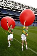 19 July 2005; Coca-Cola today celebrated their long-standing association with Féile na nGael, by offering fans the chance to have bottles of Coke sleeved with the colours of their favourite GAA county team while attending games in Croke Park during July, August and September. At the photocall were Killarney brothers Connor, left and Eoin O'Riordan. Croke Park, Dublin. Picture credit; Ray McManus / SPORTSFILE