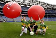 19 July 2005; Coca-Cola today celebrated their long-standing association with Féile na nGael, by offering fans the chance to have bottles of Coke sleeved with the colours of their favourite GAA county team while attending games in Croke Park during July, August and September. At the photocall were Killarney brothers Connor, left and Eoin O'Riordan with the Kerry captain Declan O'Sullivan. Croke Park, Dublin. Picture credit; Ray McManus / SPORTSFILE