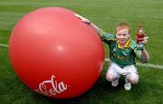 19 July 2005; Coca-Cola today celebrated their long-standing association with Féile na nGael, by offering fans the chance to have bottles of Coke sleeved with the colours of their favourite GAA county team while attending games in Croke Park during July, August and September. At the photocall is Meath supporter Patrick O'Neill. Croke Park, Dublin. Picture credit; Ray McManus / SPORTSFILE