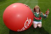 19 July 2005; Coca-Cola today celebrated their long-standing association with Féile na nGael, by offering fans the chance to have bottles of Coke sleeved with the colours of their favourite GAA county team while attending games in Croke Park during July, August and September. At the photocall is Mayo supporter Nichole Harris. Croke Park, Dublin. Picture credit; Ray McManus / SPORTSFILE
