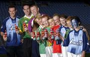 19 July 2005; Coca-Cola today celebrated their long-standing association with Féile na nGael, by offering fans the chance to have bottles of Coke sleeved with the colours of their favourite GAA county team while attending games in Croke Park during July, August and September. At the photocall were Paddy Christie, Dublin captain, Declan O’Sullivan, Kerry captain, and Damien Fitzhenry, Wexford Hurler, with young GAA fans, l to r; Nichole Harris, Mayo, Patrick O'Neill, Meath, Connor O'Riordan, Kerry, Ciara Murphy, Cork, Lucy Mortell, Dublin, Eoin O'Riordan, Kerry and Emily Mortell, Dublin, Croke Park, Dublin. Picture credit; Ray McManus / SPORTSFILE