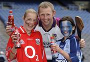 19 July 2005; Coca-Cola today celebrated their long-standing association with Féile na nGael, by offering fans the chance to have bottles of Coke sleeved with the colours of their favourite GAA county team while attending games in Croke Park during July, August and September. At the photocall were Damien Fitzhenry, Wexford Hurler, with young GAA fans Ciara Murphy, Cork, and Emily Mortell, Dublin. Croke Park, Dublin. Picture credit; Ray McManus / SPORTSFILE