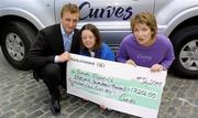 20 July 2005; Emmet O Neill and Caroline Regan of Curves Gym, Lime Street, present a cheque to Special Olympics Ireland athlete Laura Jane Dunne. Several branches of Curves gyms nationwide held fundraising initiatives and raised over €17,000 for the Special Olympics Ireland GO! campaign. Curves Gym, Lime Street, Dublin. Picture credit; Damien Eagers / SPORTSFILE