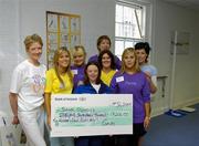 20 July 2005; Special Olympics Ireland athlete Laura Jane Dunne is presented with a cheque by members of Curves Gym Lime Street, Liz Kielty, Cheryl McGreevey, Sarah Kelly, Maria Ingle, Caoimhe Crinigan, Bronagh Kingston and Caroline Regan. Several branches of Curves gyms nationwide held fundraising initiatives and raised over €17,000 for the Special Olympics Ireland GO! campaign. Curves Gym, Lime Street, Dublin. Picture credit; Damien Eagers / SPORTSFILE