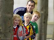19 July 2005; Westmeath footballer Dessie Dolan with Hannah Walsh, age 3, from Swords, Jack Ryan, centre, age 3, from Kilkenny, and John Mitchell, age 6, from Meath, at the announcement that Ireland's 8th National Coaching Forum, which is coordinated by the National Coaching and Training Centre (NCTC), in association with Lucozade Sport, will take place in Limerick from 2-4 September. Kildare Street, Dublin. Picture credit; Brian Lawless / SPORTSFILE
