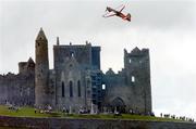 21 July 2005; Pilot Mike Mangold, USA, in his Edge 540 aircraft, flies by the Rock of Cashel, during the pilots practice run in advance of Sunday's Red Bull Air Race. Cashel, Co. Tipperary. Picture credit; David Maher / SPORTSFILE