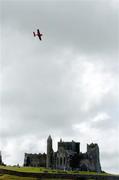 21 July 2005; Pilot Klaus Schrodt, Germany, in his Extra 330XS aircraft, flies by the Rock of Cashel, during the pilots practice run in advance of Sunday's Red Bull Air Race. Cashel, Co. Tipperary. Picture credit; David Maher / SPORTSFILE