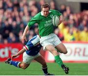 4 March 2000; Denis Hickie, Ireland, slips past the tackle of Diego Doninguez, Italy. Six Nations Rugby International, Ireland v Italy, Lansdowne Road, Dublin. Picture credit: Damien Eagers / SPORTSFILE