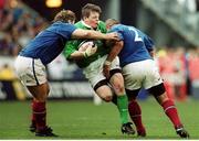 19 March 2000; Brian O'Driscoll, Ireland, is tackled by Franck Tournaire, left, and Marc Dal Maso, France. Six Nations Rugby International, France v Ireland, Stade de France, Paris, France. Picture credit: Matt Browne / SPORTSFILE