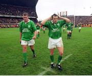 1 April 2000;  Dejected Ireland players Rob Henderson, right, and Jeremy Davidson leave the field after the game. Six Nations Rugby International, Ireland v Wales, Lansdowne Road, Dublin. Picture credit: Brendan Moran / SPORTSFILE