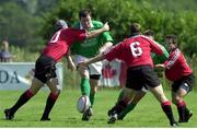 17 June 2000; Anthony Foley, Ireland, is tackled by Scott Stewart, (10) and Gregor Dixon, (6) Canada. Rugby International, Canada v Ireland,  Fletcher's Fields, Ontario, Canada. Picture credit: Matt Browne / SPORTSFILE