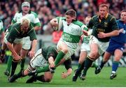 19 November 2000; Ronan O'Gara, Ireland, is tackled by Robbie Kempson, South Africa. International friendly, Ireland v South Africa, Lansdowne Road, Dublin. Picture credit: Ray Lohan / SPORTSFILE