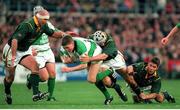 19 November 2000; Ronan O'Gara, Ireland, is tackled by Albert Van Der Berg and Mark Andrews, left, South Africa. International friendly, Ireland v South Africa, Lansdowne Road, Dublin. Picture credit: Aoife Rice / SPORTSFILE