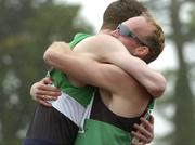 23 July 2005; Paul Brizzel, Ballymena and Antrim A.C. is congratulated by club-mate Caolan Flanagan, left, after victory in the Men's 200m Final during the AAI National Track and Field Championships. Morton Stadium, Santry, Dublin. Picture credit; Pat Murphy / SPORTSFILE