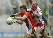 23 July 2005; Ronan Clarke, Armagh, is tackled by Chris Lawn, Tyrone. Bank of Ireland Ulster Senior Football Championship Final Replay, Tyrone v Armagh, Croke Park, Dublin. Picture credit; Damien Eagers / SPORTSFILE