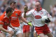 23 July 2005; Chris Lawn, Tyrone, in action against Ronan Clarke and Oisin McConville, left, Armagh. Bank of Ireland Ulster Senior Football Championship Final Replay, Tyrone v Armagh, Croke Park, Dublin. Picture credit; Damien Eagers / SPORTSFILE