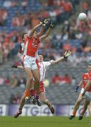 23 July 2005; Philip Loughran, Armagh, contests a high ball with Sean Cavanagh and Conor Gormley, Tyrone. Bank of Ireland Ulster Senior Football Championship Final Replay, Tyrone v Armagh, Croke Park, Dublin. Picture credit; Brendan Moran / SPORTSFILE