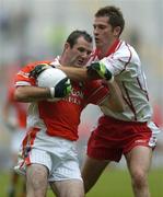 23 July 2005; Stephen McDonnell, Armagh, is tackled by Shane Sweeney, Tyrone. Bank of Ireland Ulster Senior Football Championship Final Replay, Tyrone v Armagh, Croke Park, Dublin. Picture credit; Damien Eagers / SPORTSFILE