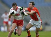 23 July 2005; Sean Cavanagh, Tyrone, is tackled by Enda McNulty, Armagh. Bank of Ireland Ulster Senior Football Championship Final Replay, Tyrone v Armagh, Croke Park, Dublin. Picture credit; Matt Browne / SPORTSFILE