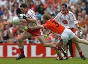 23 July 2005; Sean Cavanagh, Tyrone, is tackled by Francie Bellew, Armagh. Bank of Ireland Ulster Senior Football Championship Final Replay, Tyrone v Armagh, Croke Park, Dublin. Picture credit; Matt Browne / SPORTSFILE
