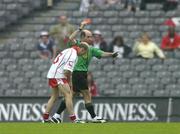 23 July 2005; Peter Canavan, Tyrone, is shown a red card by referee Michael Collins. Bank of Ireland Ulster Senior Football Championship Final Replay, Tyrone v Armagh, Croke Park, Dublin. Picture credit; Brendan Moran / SPORTSFILE