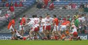 23 July 2005; Ciaran McKeever (19), Armagh, pulls Tyrone's Peter Canavan away from a melee involving players from both sides. Canavan was subsequently shown a red card. Bank of Ireland Ulster Senior Football Championship Final Replay, Tyrone v Armagh, Croke Park, Dublin. Picture credit; Brendan Moran / SPORTSFILE