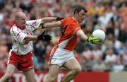 23 July 2005; Ronan Clarke, Armagh, is tackled by Chris Lawn, Tyrone. Bank of Ireland Ulster Senior Football Championship Final Replay, Tyrone v Armagh, Croke Park, Dublin. Picture credit; Matt Browne / SPORTSFILE