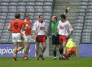 23 July 2005; Stephen O'Neill, 3rd from left, Tyrone, is shown a second yellow card by referee Michael Collins and consequently sent off. Bank of Ireland Ulster Senior Football Championship Final Replay, Tyrone v Armagh, Croke Park, Dublin. Picture credit; Brendan Moran / SPORTSFILE