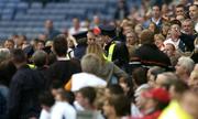 23 July 2005; Gardai move in to control spectators in the Hogan Stand immediately follwing the sending off of Tyrone's Peter Canavan. Bank of Ireland Ulster Senior Football Championship Final Replay, Tyrone v Armagh, Croke Park, Dublin. Picture credit; Brendan Moran / SPORTSFILE