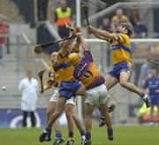 24 July 2005; Sean McMahon, and Brian O'Connell, (no helmet), Clare, in action against Rory McCarthy, Wexford. Guinness All-Ireland Senior Hurling Championship Quarter-Final, Wexford v Clare, Croke Park, Dublin. Picture credit; Damien Eagers / SPORTSFILE