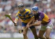 24 July 2005; Tony Carmody, Clare, is tackled by David O'Connor, Wexford. Guinness All-Ireland Senior Hurling Championship Quarter-Final, Wexford v Clare, Croke Park, Dublin. Picture credit; Damien Eagers / SPORTSFILE