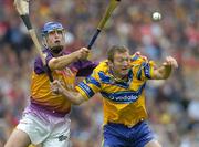 24 July 2005; Declan O'Rourke, Clare, is tackled by David O'Connor, Wexford. Guinness All-Ireland Senior Hurling Championship Quarter-Final, Wexford v Clare, Croke Park, Dublin. Picture credit; Brendan Moran / SPORTSFILE