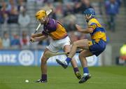 24 July 2005; Eoin Quigley, Wexford, in action against Alan Markham, Clare. Guinness All-Ireland Senior Hurling Championship Quarter-Final, Wexford v Clare, Croke Park, Dublin. Picture credit; Ray McManus / SPORTSFILE