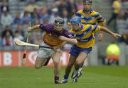 24 July 2005; Michael Jacob, Wexford, is tackled by Alan Markham, Clare. Guinness All-Ireland Senior Hurling Championship Quarter-Final, Wexford v Clare, Croke Park, Dublin. Picture credit; Ray McManus / SPORTSFILE