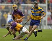 24 July 2005; Sean McMahon, Clare, in action against Michael Jordan and Eoin Quigley, centre, Wexford. Guinness All-Ireland Senior Hurling Championship Quarter-Final, Wexford v Clare, Croke Park, Dublin. Picture credit; Damien Eagers / SPORTSFILE